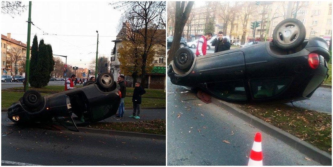 ACCIDENT ÎN CENTRU. O mașină s-a întors cu roțile-n sus după ce s-a izbit de un copac (FOTO)