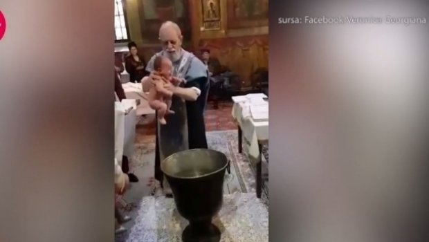 Preotul care a bruscat un copil la botez, suspendat de la oficierea slujbelor