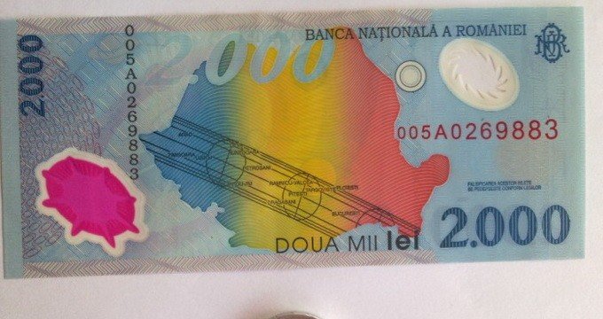 Ai acasă o bancnota de 2.000 de lei de la eclipsa din 1999? S-ar putea să te îmbogăţeşti 